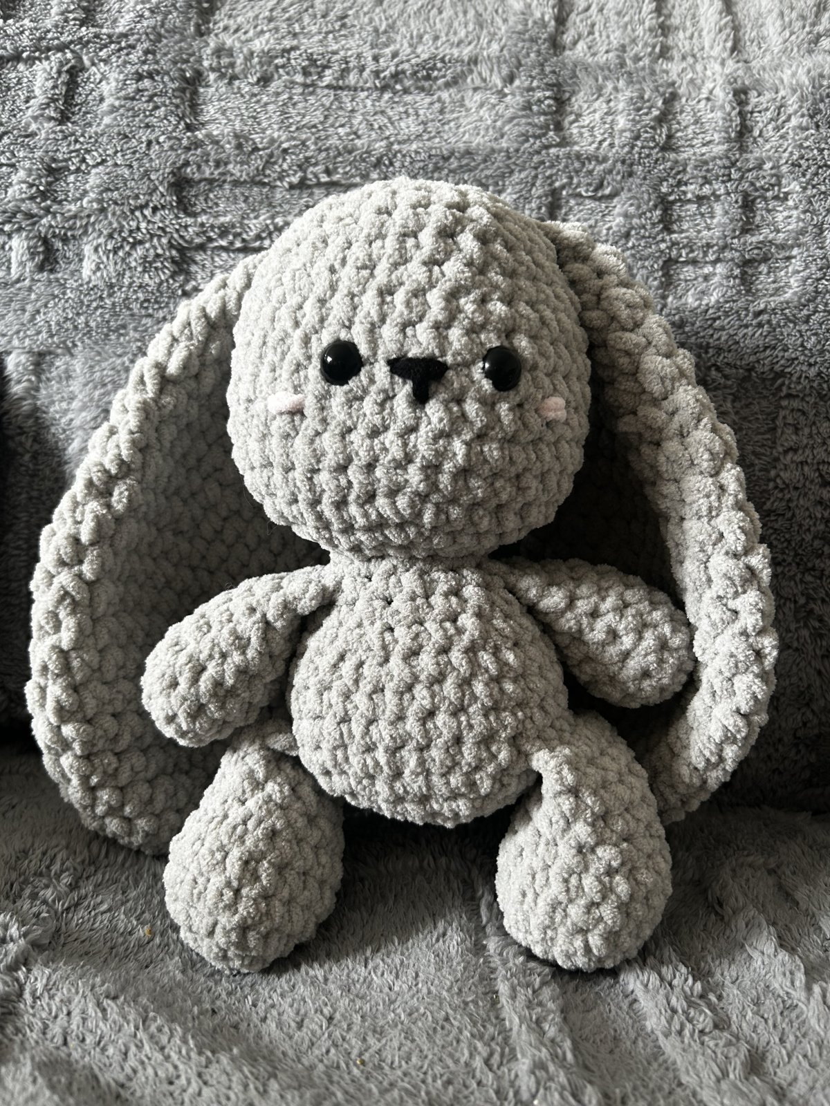 Soft grey crochet bunny plushie with long floppy ears