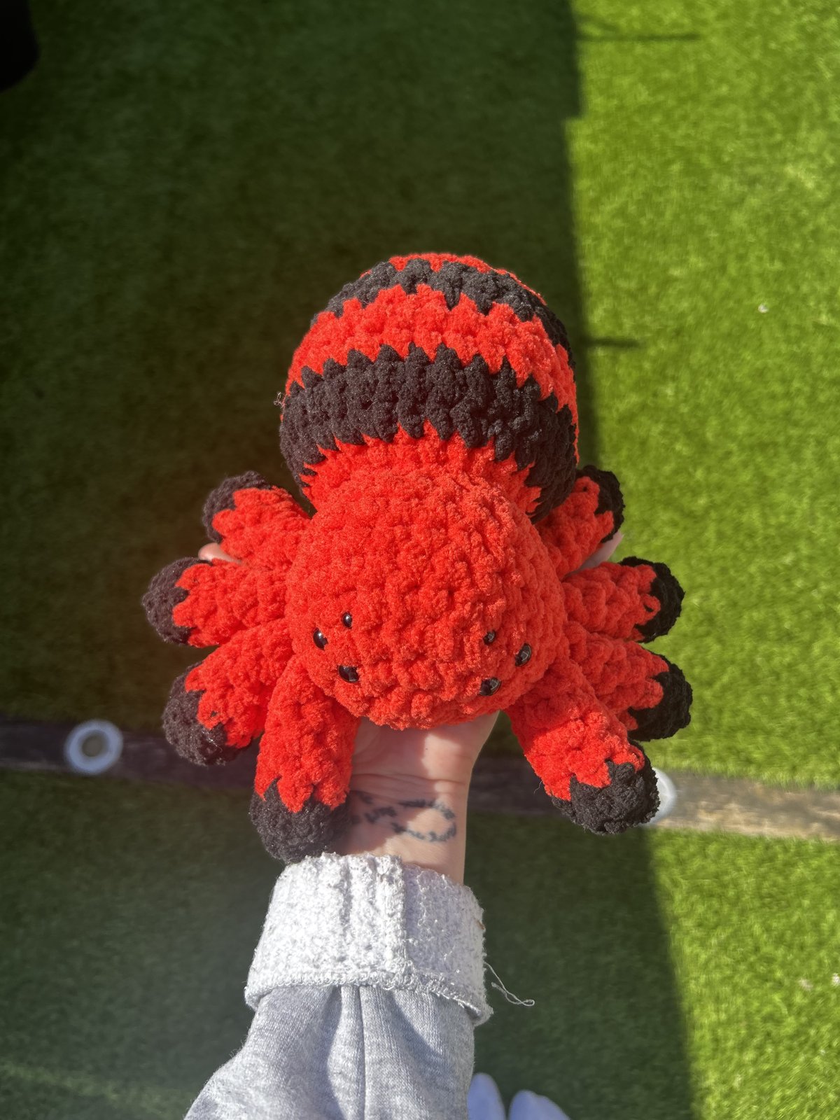 Red and black crochet spider plushie